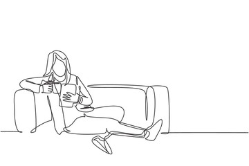 Wall Mural - One continuous line drawing of young businesswoman lying down on the sofa while reading book and holding a cup of coffee drink. Drinking tea concept single line draw vector design graphic illustration