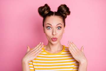 Wall Mural - Closeup photo of attractive pretty funny expression lady two buns sending air kisses shy girlish surprised person wear casual white yellow striped shirt isolated pink color background