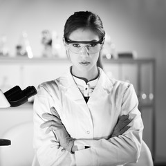 Fototapete - Portrait of a attractive, young, confident female health care professional in hes working environment. Black and white image.