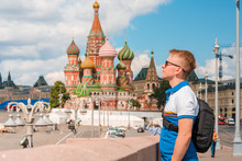 Portrait Of A Man Blond Tourist On A Sunny Day Against The Background Of The Kremlin In Moscow
