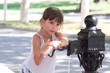 © waldemarus - Little girl open the old street free standpipe in summer on blurred background. Outdoors