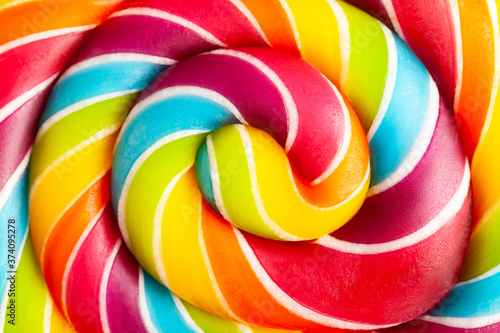 Photographie Close up of rainbow colored lollipop
