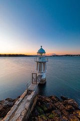 Wall Mural - clear sky at dawn at cremorne point lighthouse, sydney, australia.