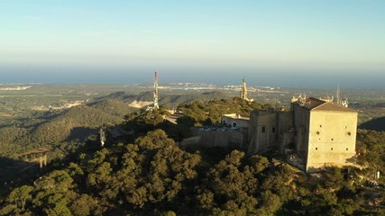 Poster - flying a drone over the monastery and statue of Christ sanctuary of San Salvador Majorca Spain