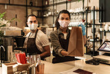 Fototapeta  - Coffee shop owners with face masks, lockdown