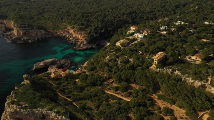 Canvas Print - flying a drone over the Bay of Caló del Moro Mallorca Spain