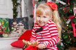 © Valeriya - christmas little girl in red clothes