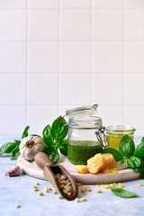 Wall Mural - Traditional italian sauce basil pesto with fresh ingredients for making.