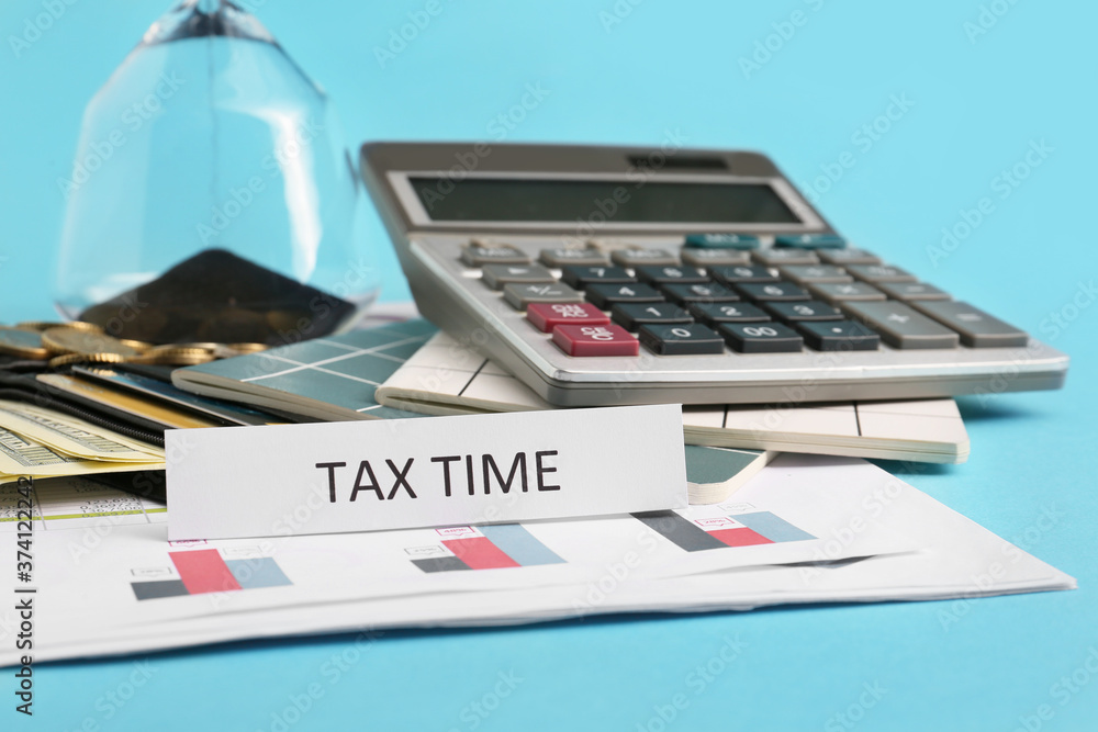 Calculator and money on color background. Concept of tax deadline