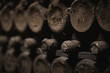 © macondos - aged wine bottles covered with mold in vintage wine cellar