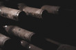 © macondos - aged wine bottles covered with mold in vintage wine cellar