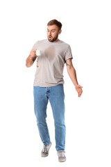 Sticker - Stressed young man with coffee stains on his t-shirt on white background