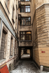 Arch in the entrance courtyard of an old apartment building in St. Petersburg