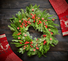 Wall Mural - Christmas wreath on dark wooden background