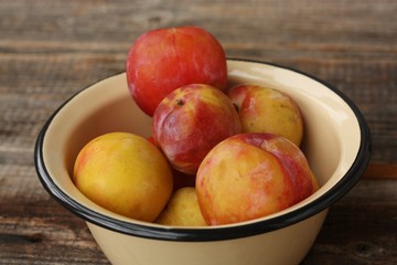 Canvas Print - Juicy seasonal plums on the table macro