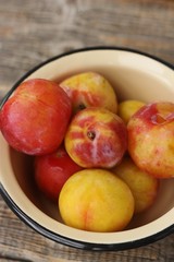 Canvas Print - Juicy seasonal plums on the table macro