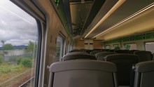 A View Of An Empty UK Train Travelling With A View From Within A Train Carriage And Partially The Outside View From The Train Window