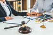 © joyfotoliakid - Judges Female lawyers Consultation of business women legal services Consulting in regard to the various contracts to plan the case in court.