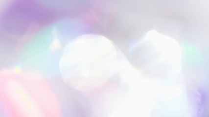 Wall Mural - Optical Rainbow Flares and Flickers. Bright iridescent highlights and shimmers are created by rotating motion within the multi-faceted crystal