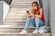 © Alvaro - Young woman using her mobile phone in the city. Concept of new technologies and social networks.