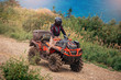 © Parilov - ATV bike rides through forest off-road in trip summer