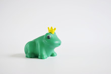 Green Rubber Toy Frog On A White Background