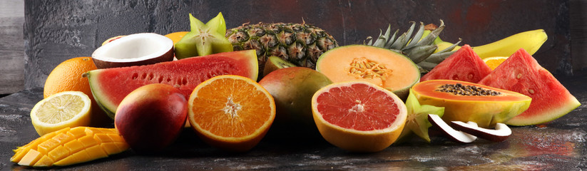 Tropical fruits background, many colorful ripe fresh tropical exotic fruits