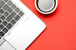 © Patricia - top view of workspace on a red background with laptop and coffee. Flat lay