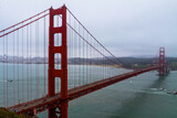 Fototapeta Zachód słońca - The Golden Gate Bridge and Foggy San Francisco Skyline With San Francisco Bay, San Francisco,California,USA