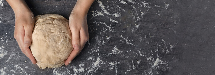 woman kneading dough at table, top view. banner design with space for text