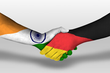 Wall Mural - Handshake between germany and india flags painted on hands, illustration with clipping path.