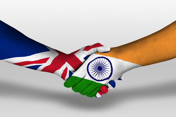 Wall Mural - Handshake between india and united kingdom flags painted on hands, illustration with clipping path.