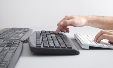 Wall Mural - Man typing on computer keyboard.