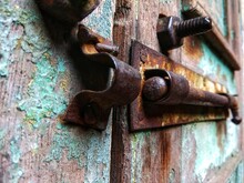 Old Rusty Bolt And Iron Door Lock On A Antique Blue Wooden Door