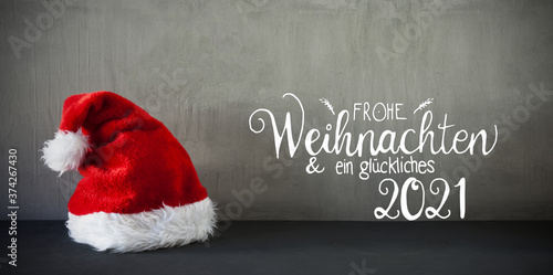 Photographie Red Santa Hat, Cement, Calligraphy Glueckliches 2021 Means Happy 2021