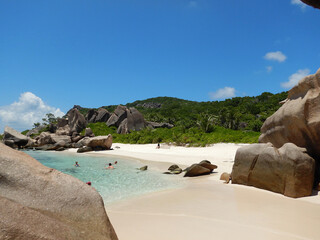 Wall Mural - Anse Marron Beach, Seychelles. Highlighs are a Natural saltwater pool cut off from the open ocean by imposing boulder formations, beauty of the beach, beautiful sand, and the clear ocean water.