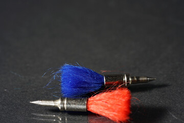 Poster - Closeup shot of the red and blue dart arrows