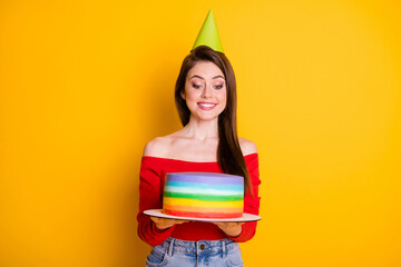 Sticker - Portrait of her she nice attractive lovely cheerful cheery girl holding in hands striped homemade fresh tasty cake isolated bright vivid shine vibrant yellow color background