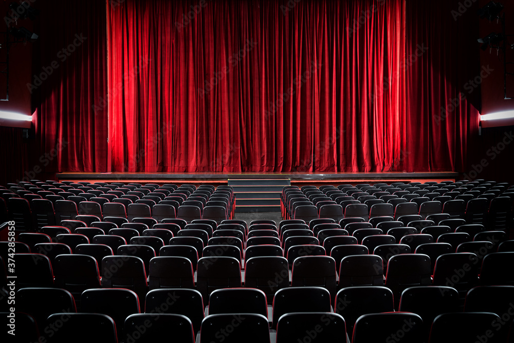 Darkened empty movie theatre and stage - obrazy, fototapety, plakaty 
