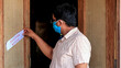 © asiraj - Asian man finds eviction notice on the door of the house