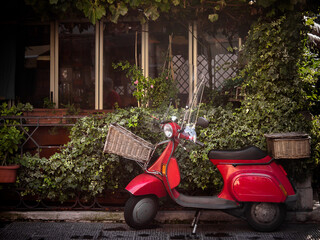 traditional transport holiday in italy, red vintage scooter
