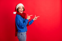 If You Want Christmas Discount Go Here. Shocked Girl Santa Claus Headwear Point Finger Copyspace Indicate Adverts Wear Blue Knitted Sweater Denim Jeans Isolated Bright Shine Color Background