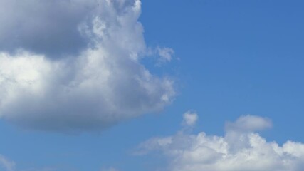 Wall Mural - Blue sky white clouds. Puffy fluffy white clouds timelapse. Summer blue sky time lapse.