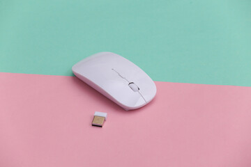 Wall Mural - White modern wireless pc mouse on pink blue background.