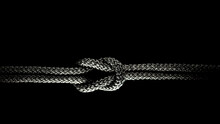 Reef Knot Black Rope On A Black Background.