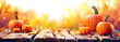 Leinwandbild Motiv Pumpkins On Aged Plank At Sunset - Autumn And Harvest Table
