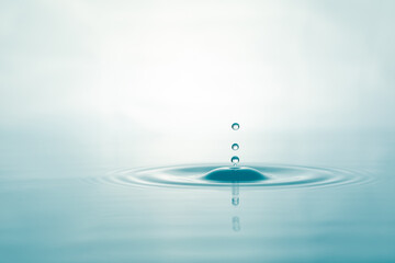 Wall Mural - Water droplets on surface water background