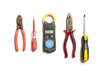 Wall Mural - Top view of Working tools for electrician,hammer,screwdriver,plier,electric drill, measure,on white background.