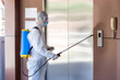 © Pornsak - Male medical staff wearing PPE suits to protect against COVID-19 using nebulizers. And use chemicals disinfectant People transport elevator.