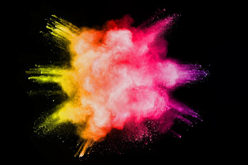 Wall Mural - explosion of colored powder isolated on black background.